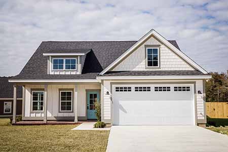 country style home with asphalt roof